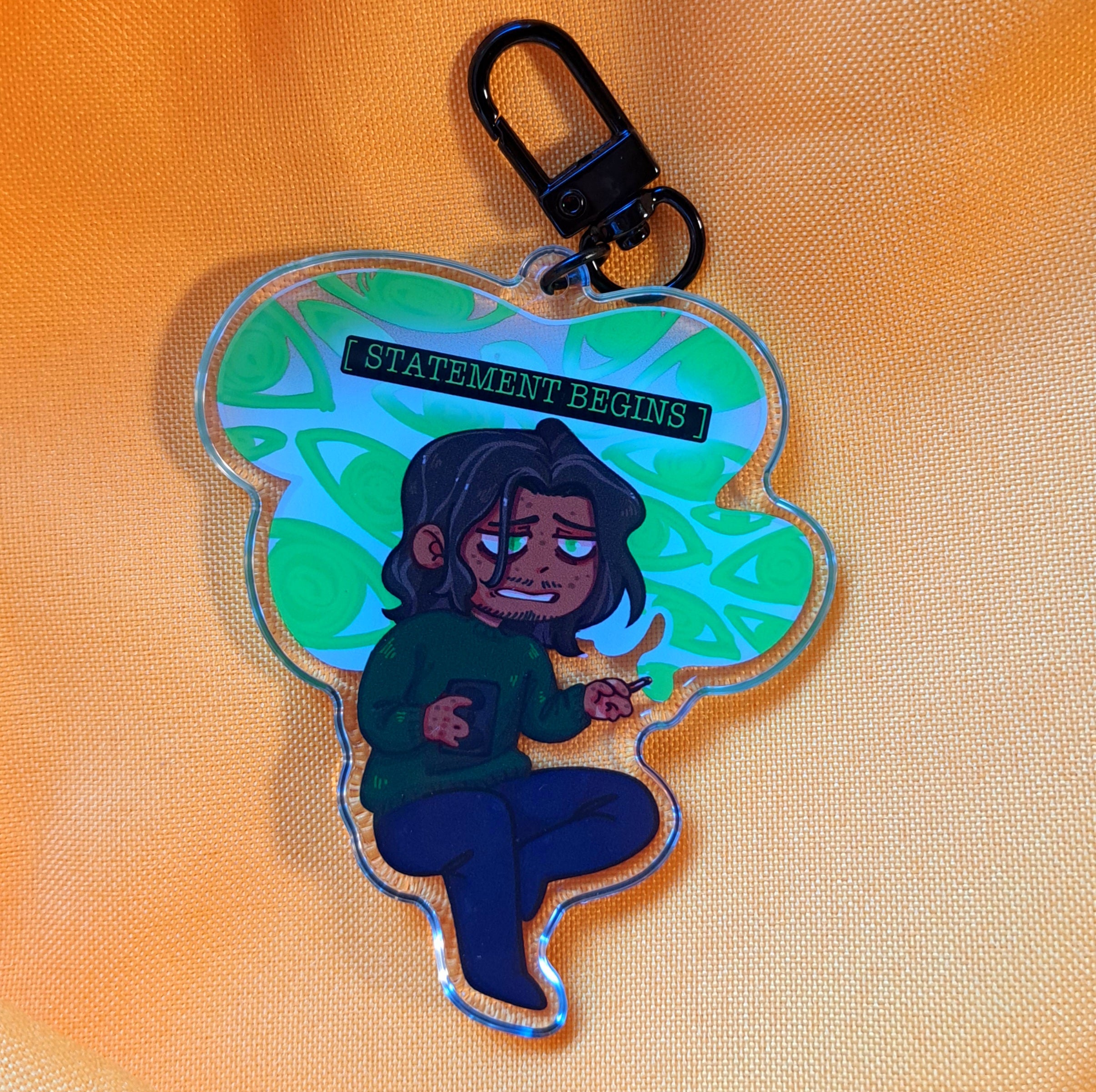 Statement Begins keychain